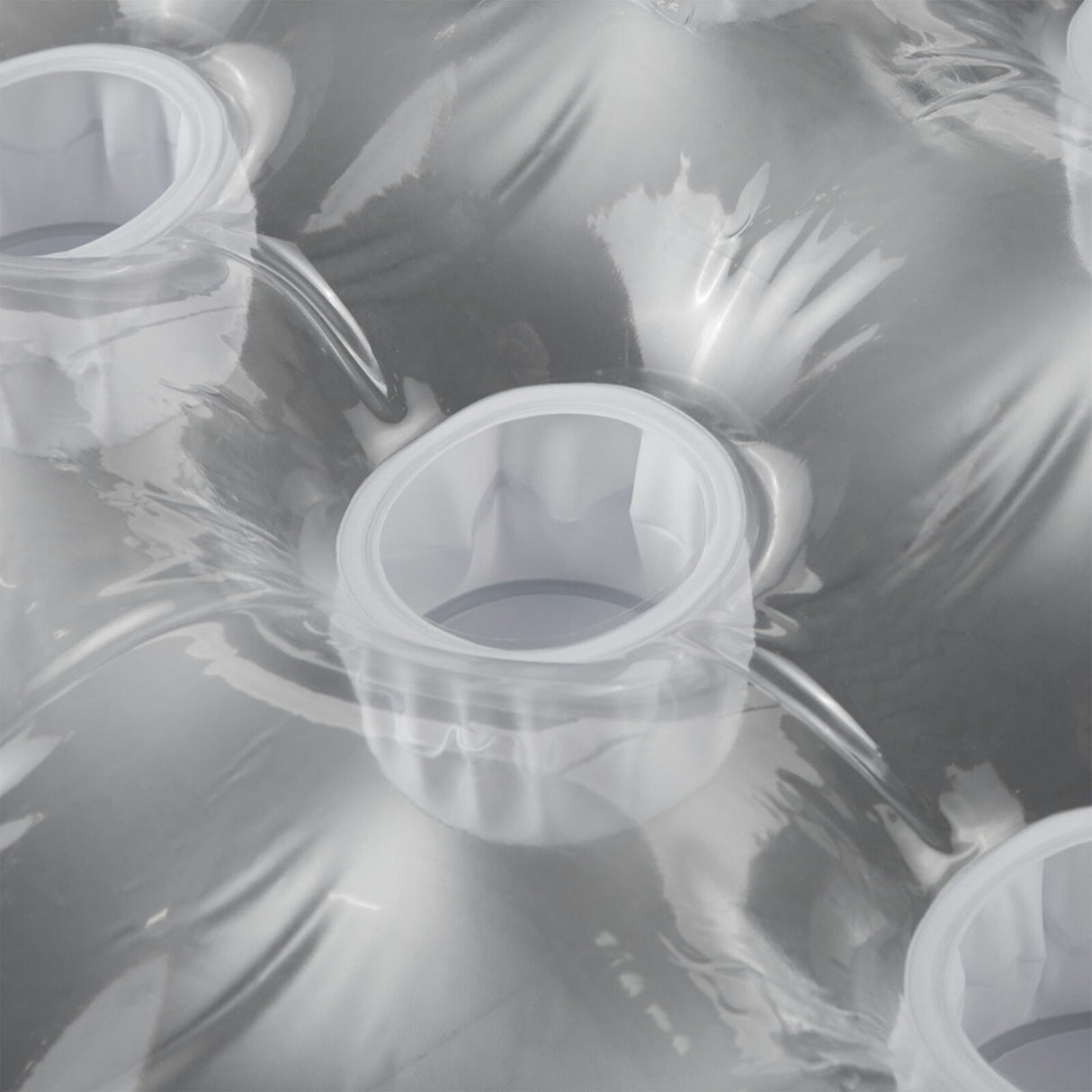 Silver inflatable pool mattress.