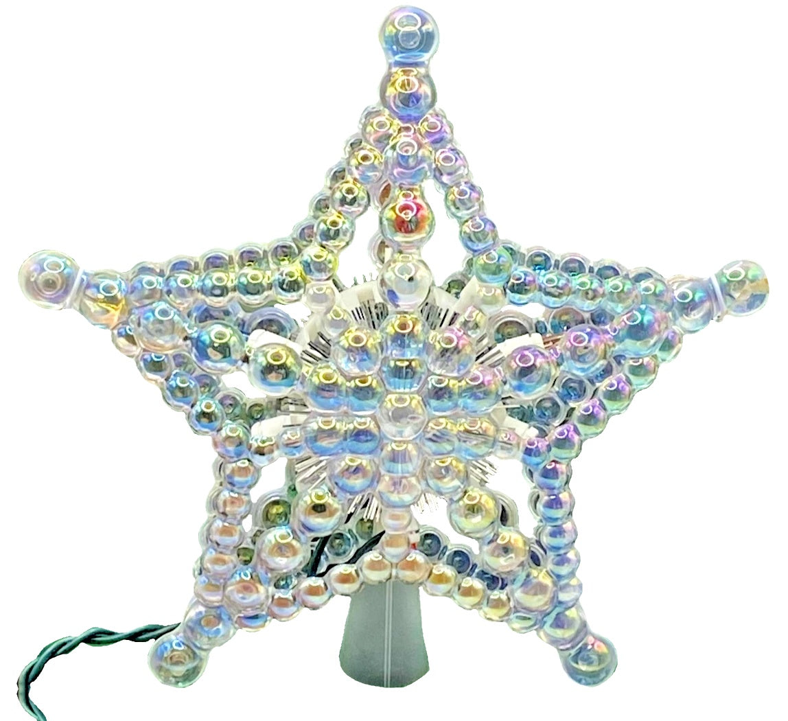 This image shows how iridescent the beaded tree star is on a white background.