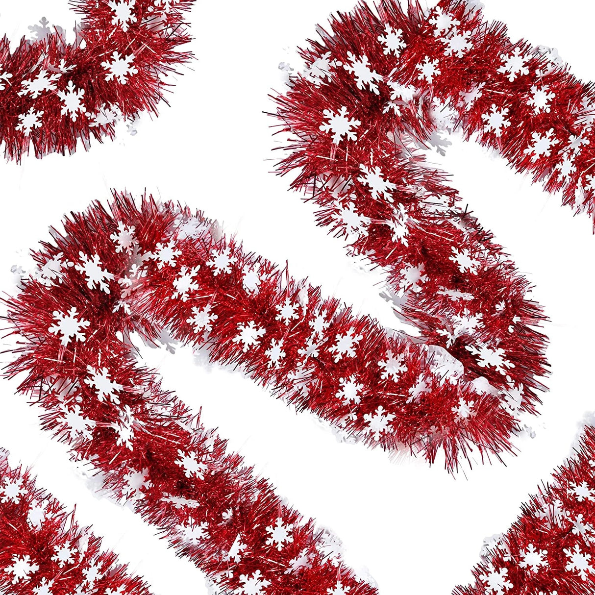 Red tinsel garland with white snowflake decorations on a white background