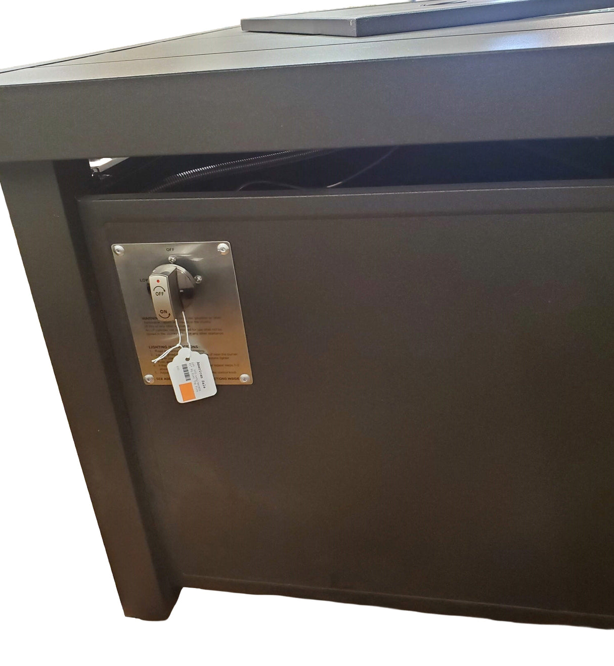 This image shows what the ON/OFF button looks like for this fire pit table.