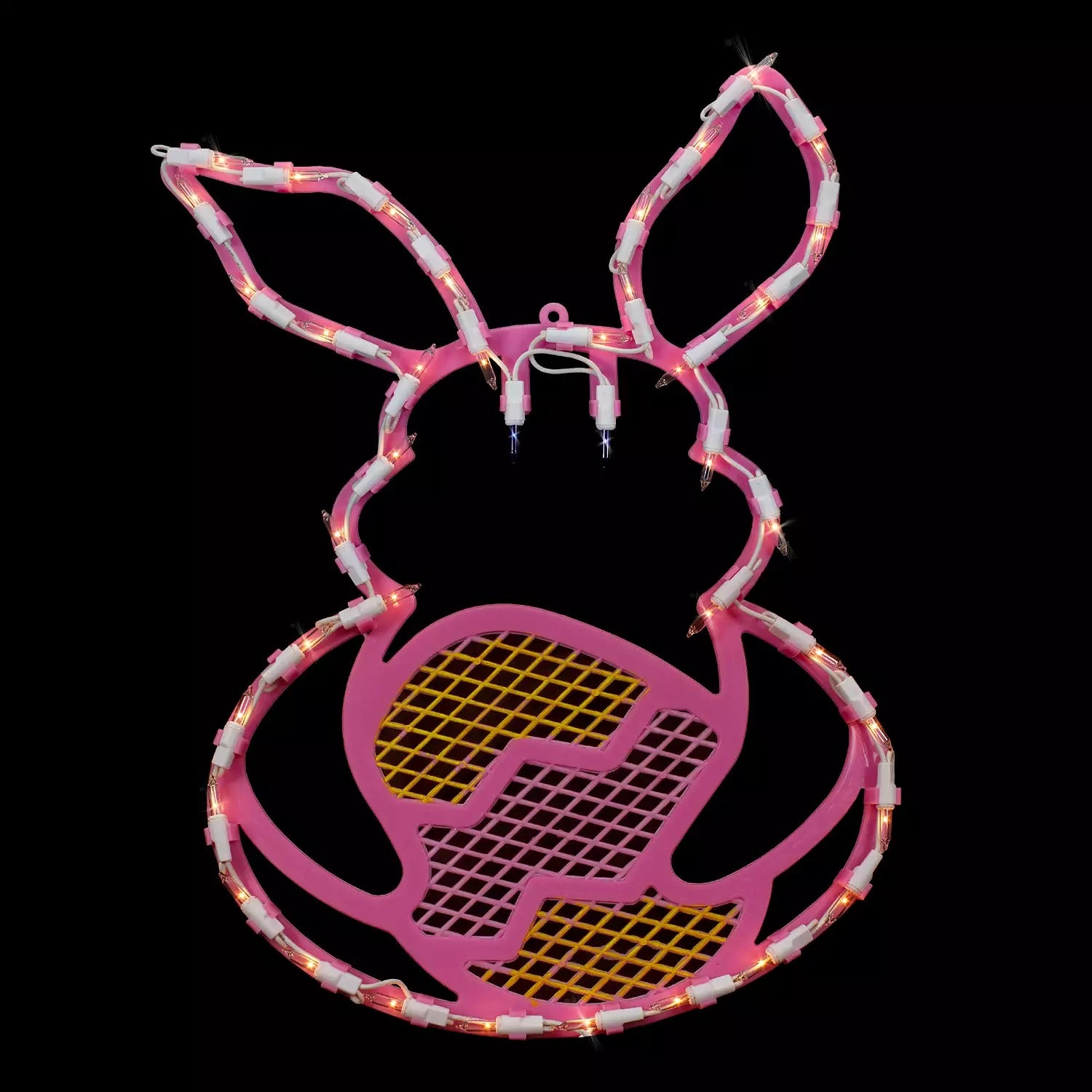 A pink window silhouette decoration shaped like a bunny holding a yellow egg on a black background