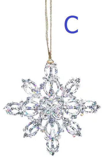 Ornaments shaped like glitter covered snowflakes.