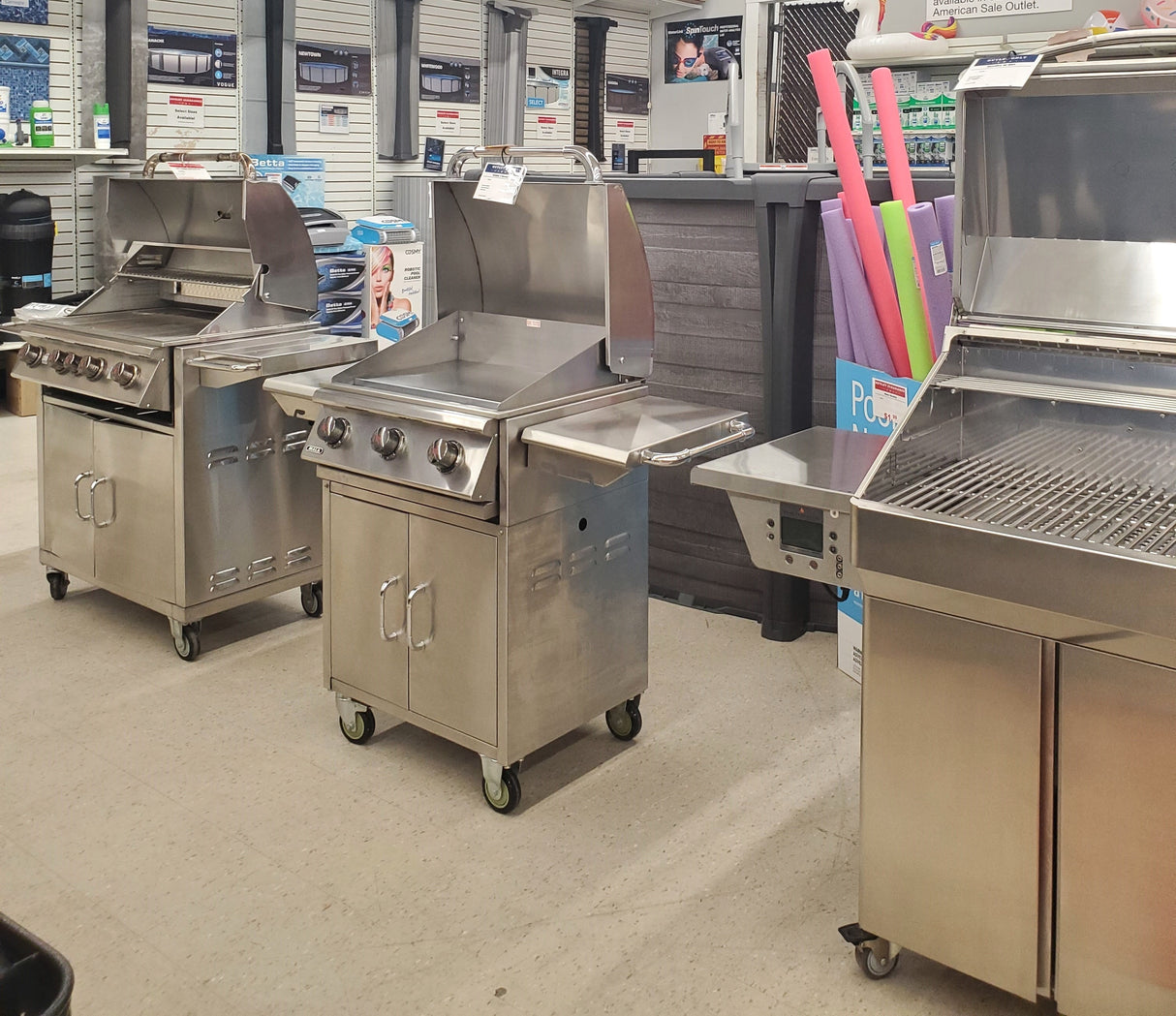 Various clearance BBQ grills on display in our Tinley Park Outlet store.