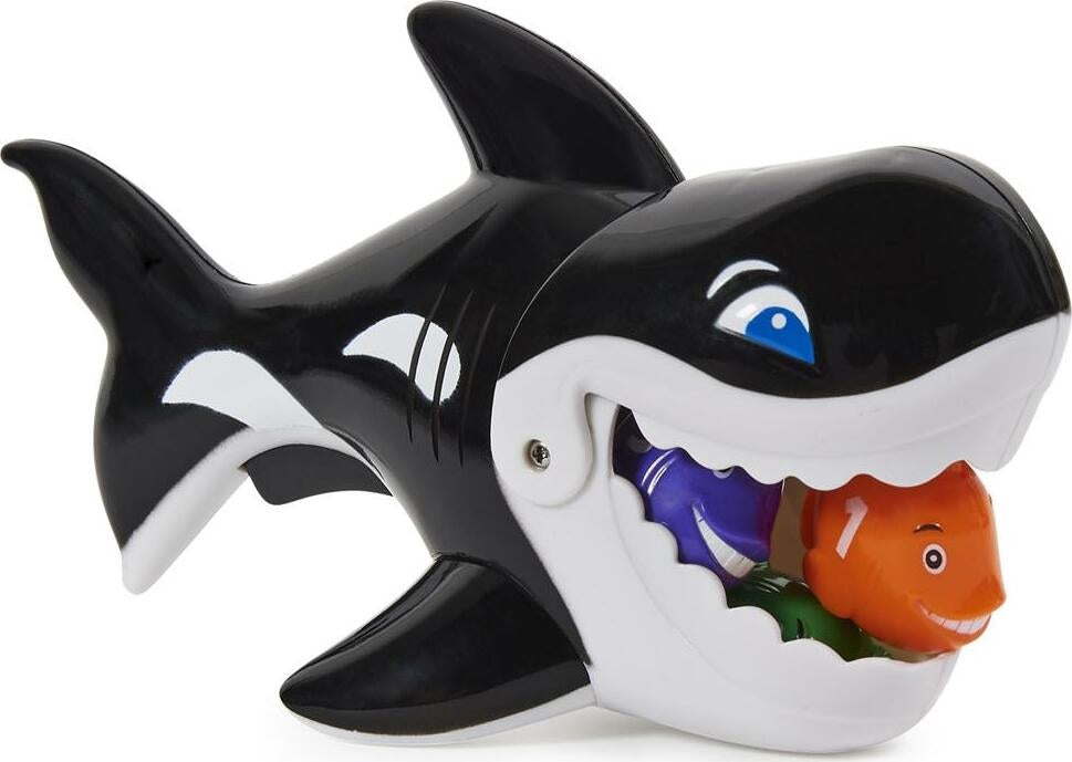 Pool game shaped like a whale whose mouth opens up. Kids try to use the whale's mouth to swallow up the little toy fish.