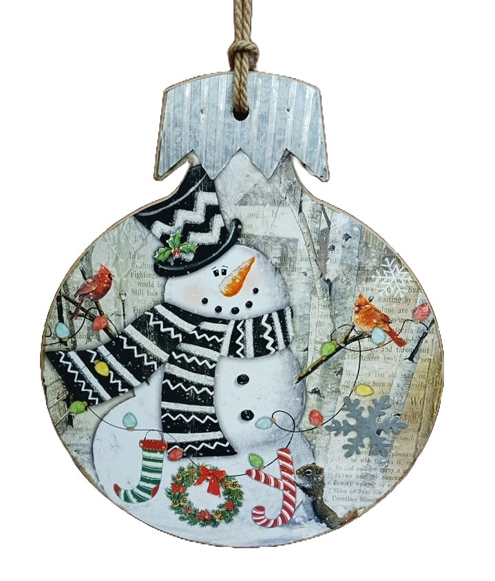 This wooden ornament features a snowman wearing a top hat and scarf with two cardinals resting on his wooden arms with a squirrel standing next to the word "Joy".