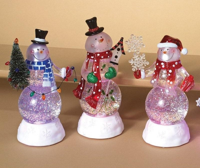 Tabletop decorations designed to look like glass snowmen. This picture shows all three options available.