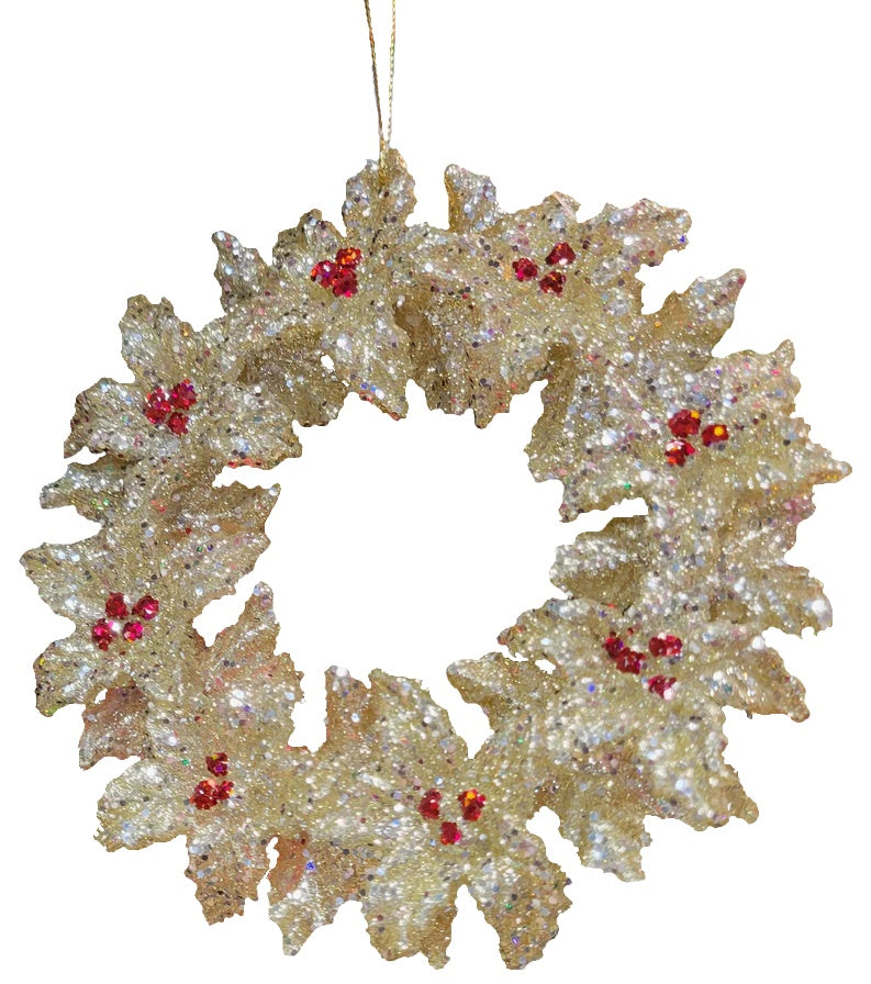 Gold glitter ornament shaped like a wreath with red berry accents.