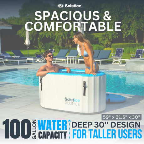 This is a lifestyle image showing a man sitting in the inflatable cold plunge while a woman stands in it while they chat. It reads: "Spacious and comfortable. 100 gallon water capacity. Deep 30 inch design for taller users." It measures 59 inches by 31.5 inches by 30 inches.