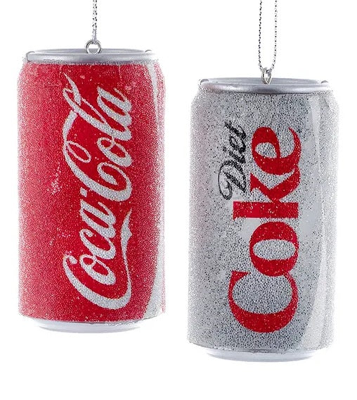 One ornament is red and reads "Coca Cola" in a white, cursive font. One ornament is silver and reads "Diet" in a black, cursive font and "Coke" in red block letters. Beads covering the outside for a frosty-cold look.