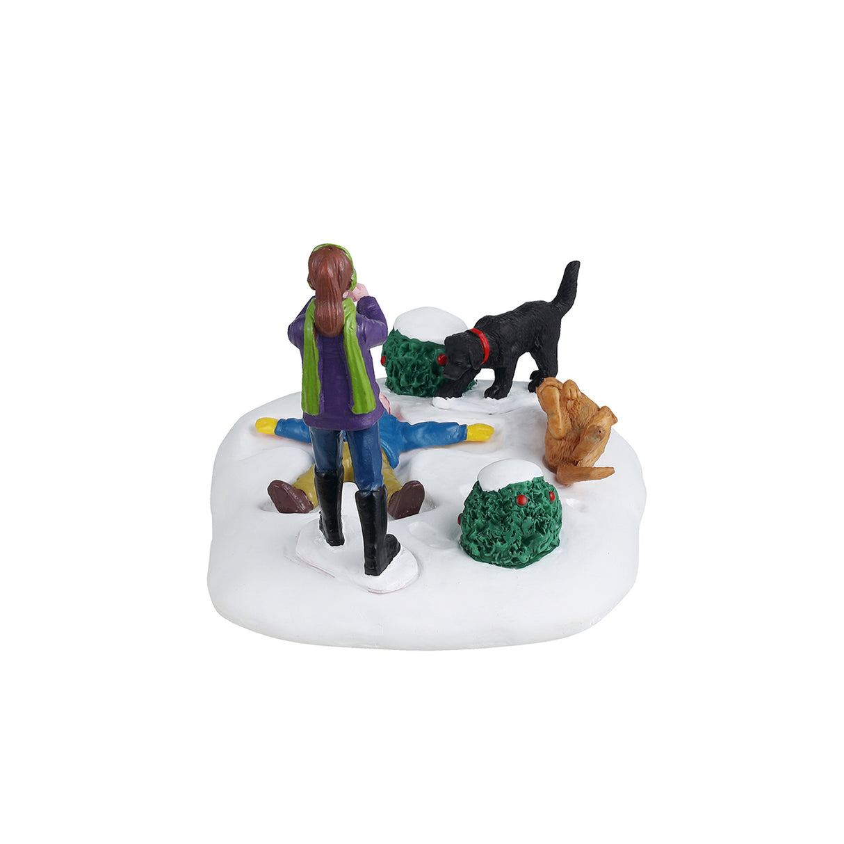 Resin table accent for a Lemax Village tabletop display. Designed to look like a young child making a snow angel while a girl takes a picture of the scene. There are two dogs and two bushes nearby. One dog is black and one is a golden brown color. The golden brown dog is laying on it's back with it's tongue hanging out. The ground is covered in snow and both kids are wearing winter clothes.