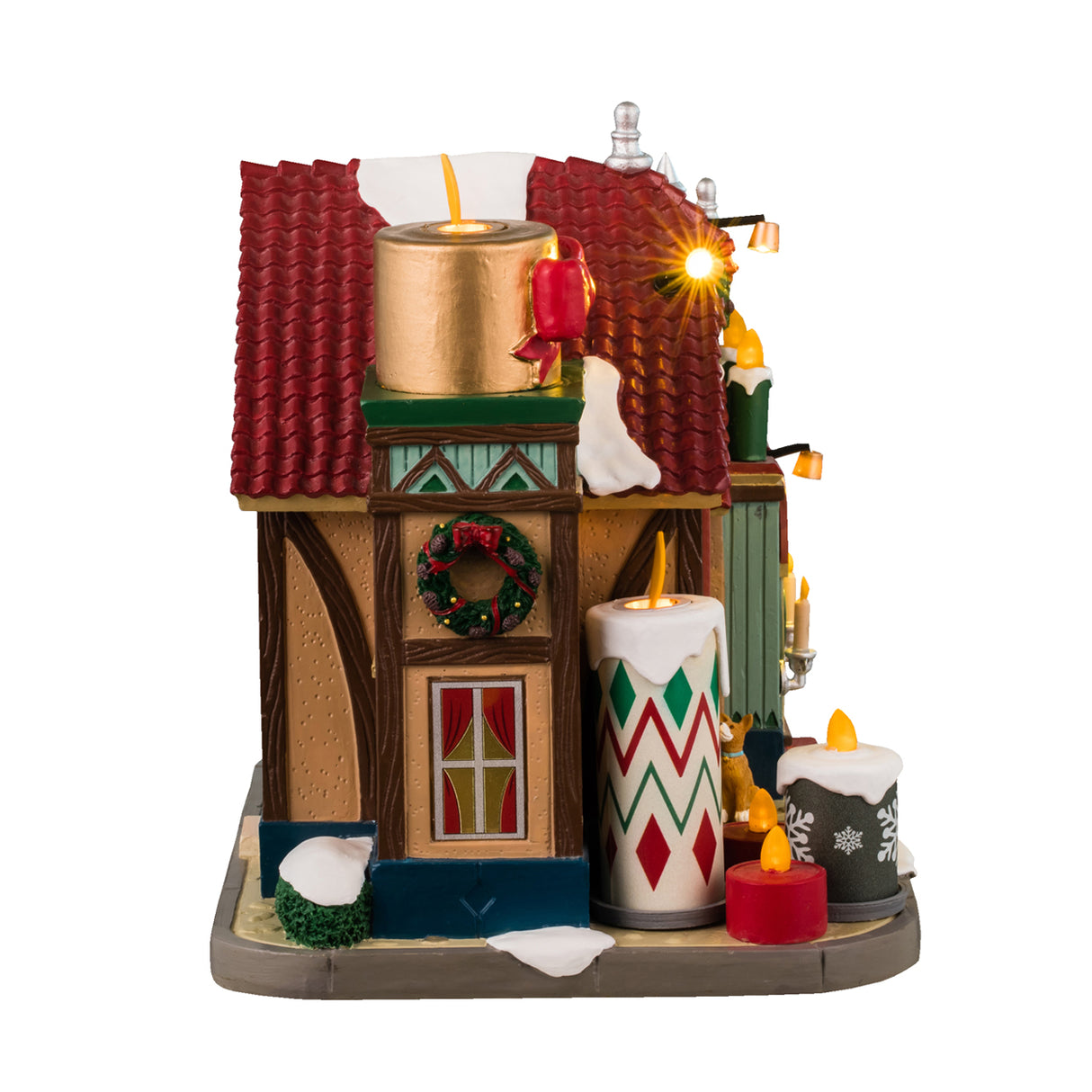 Resin lighted building for a Lemax display. Designed to look like a candle shop covered in snow. There are candle accents and wreaths and garland. There's a dog peering into the window to watch Kristin make candles.