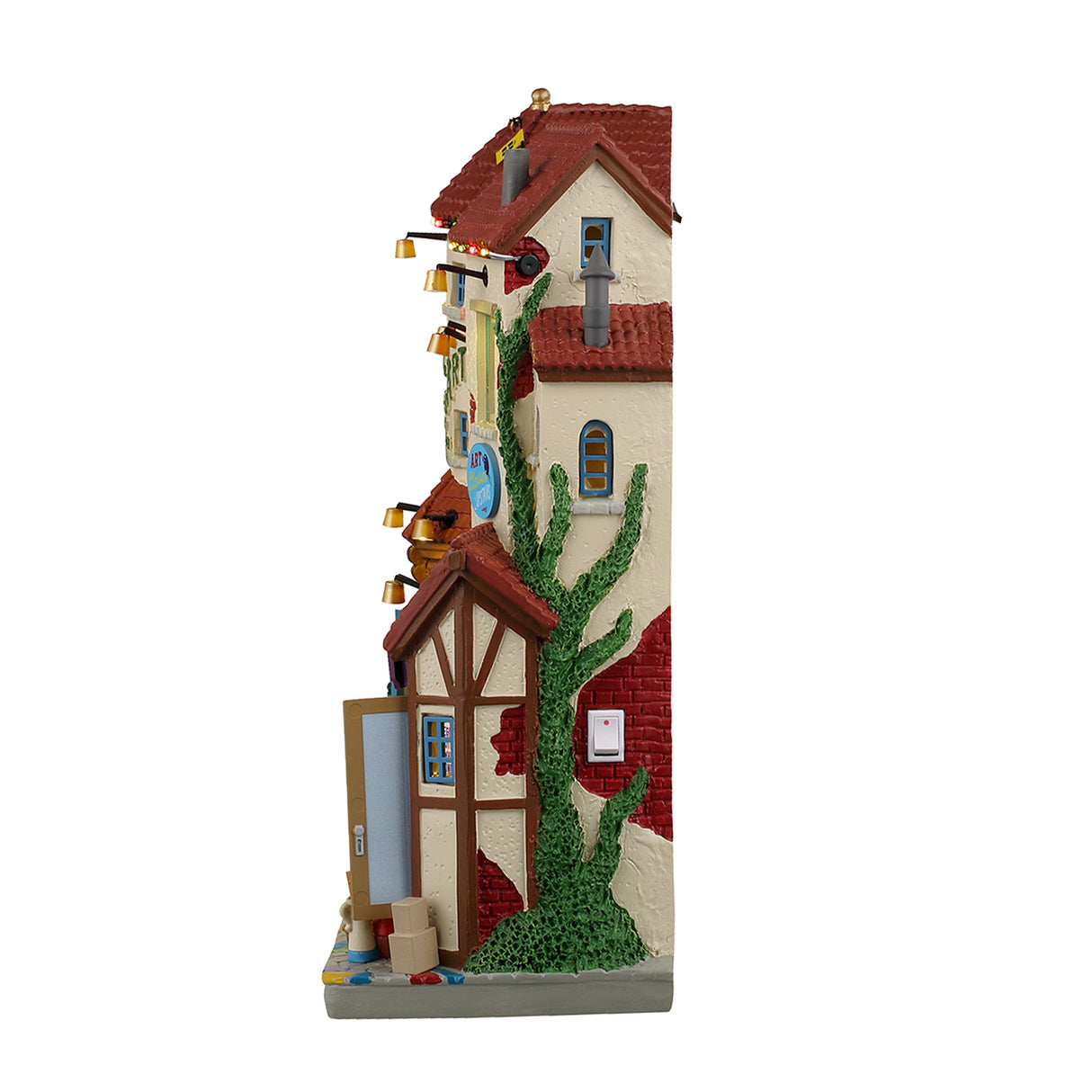 Resin lighted building façade for a Lemax display. Designed to look like a Mexican-style home (Hacienda). There are a lot of signs. Some of them read "Beginner Lessons," "Portrait Studio," "Holiday Special! Free drawing class," "Kids Art, "Cafe," "Holiday Art Sale," "Van's Pottery" and "Art Classes Upstairs." There are people everywhere shopping. There's a man making pottery and a few kids taking pictures with Santa.