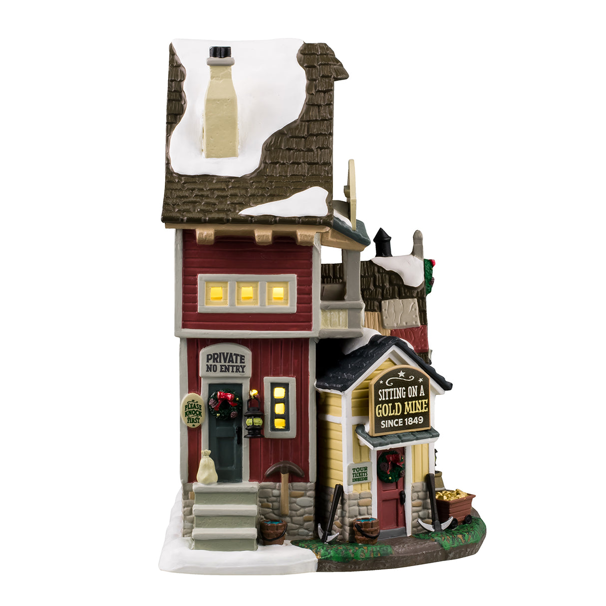 Porcelain lighted building for a Lemax display. Designed to look like a tall house with multiple signs on it. The signs read "Get your mining equipment: Picks, shovels & more!" "Lazy Gorge Gems & Gold Mine," "Sluice Box Pans & Boots," "Private No Entry," "Sitting on a gold mine since 1849," "Tour tickets inside," "Low beams; Watch your head" and "Mine Tours!"