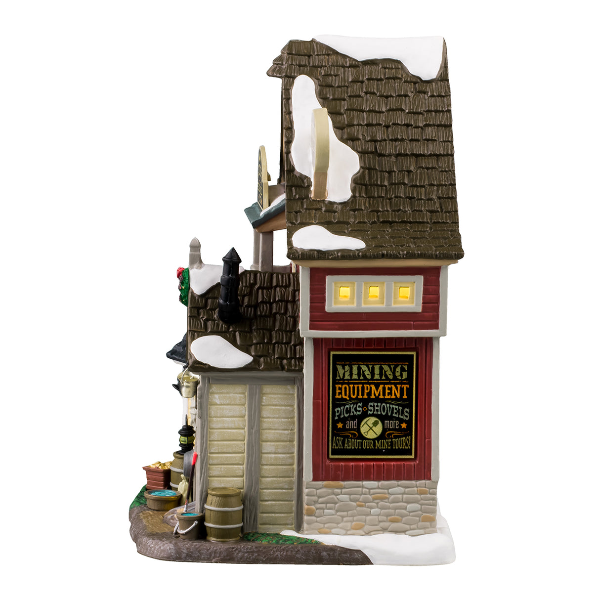 Porcelain lighted building for a Lemax display. Designed to look like a tall house with multiple signs on it. The signs read "Get your mining equipment: Picks, shovels & more!" "Lazy Gorge Gems & Gold Mine," "Sluice Box Pans & Boots," "Private No Entry," "Sitting on a gold mine since 1849," "Tour tickets inside," "Low beams; Watch your head" and "Mine Tours!"