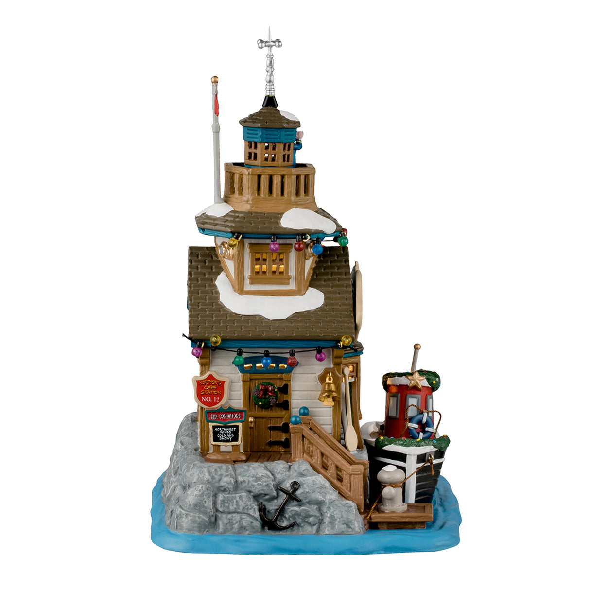 Porcelain lighted building for a Lemax display. Designed to look like a building next to a body of water. There's someone using binoculars on the balcony on the roof. There are multi-colored lights and a pelican sitting near the sign. The sign reads "Northstar Cape Harbor Master." There's a boat tied up at the dock. The boat has the word "PILOT" written on the side and has a decorated garland around it.