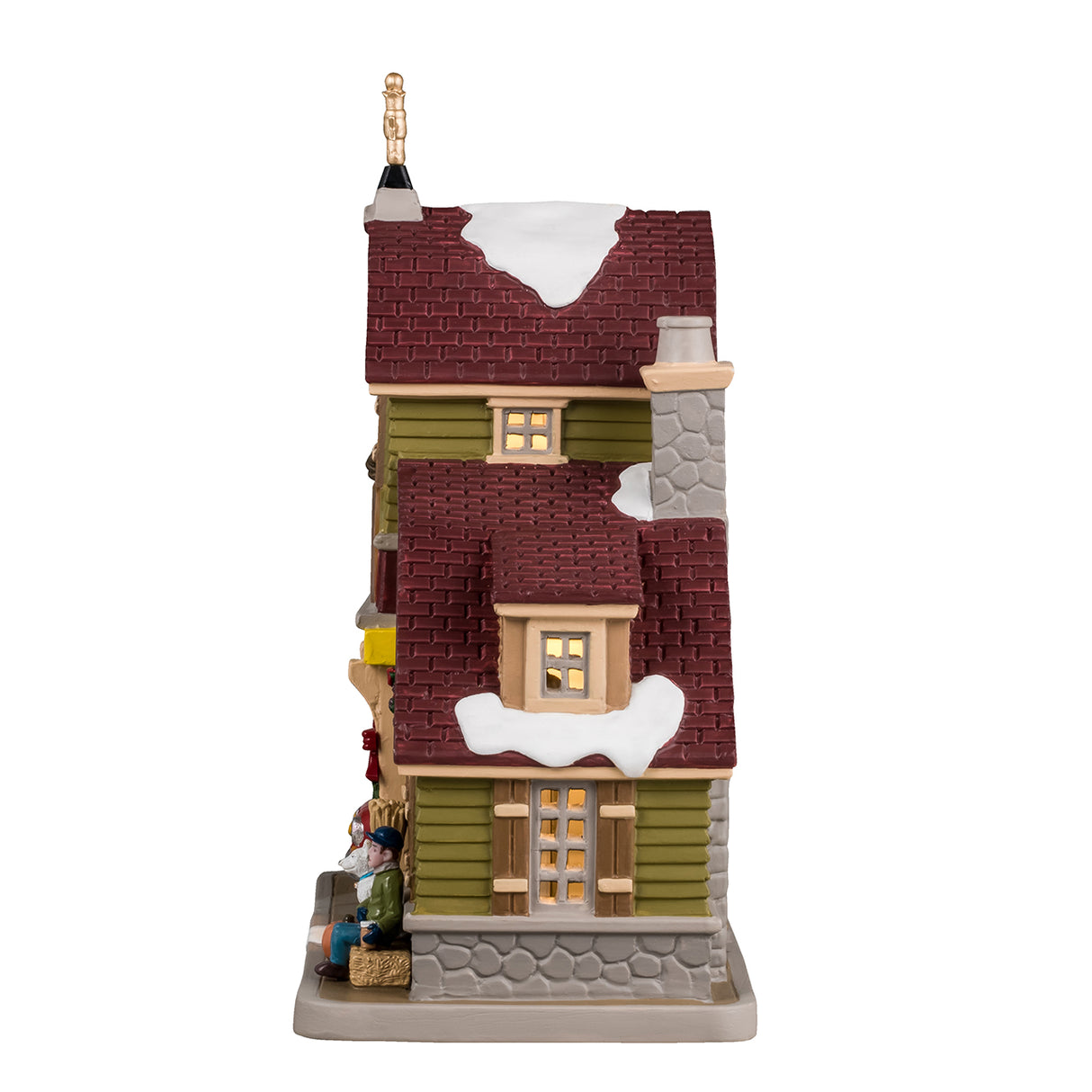 Porcelain lighted building for a Lemax display. Designed to look like a house turned into a drive-thru restaurant. There's a gold wind vine and snow on the roof. There are fall accents as well as wreaths and pine swag decorations. There's a red car ordering food in the drive thru. There's a boy sitting on a bale of hay next to a white dog. You can see a woman inside the building serving coffee.