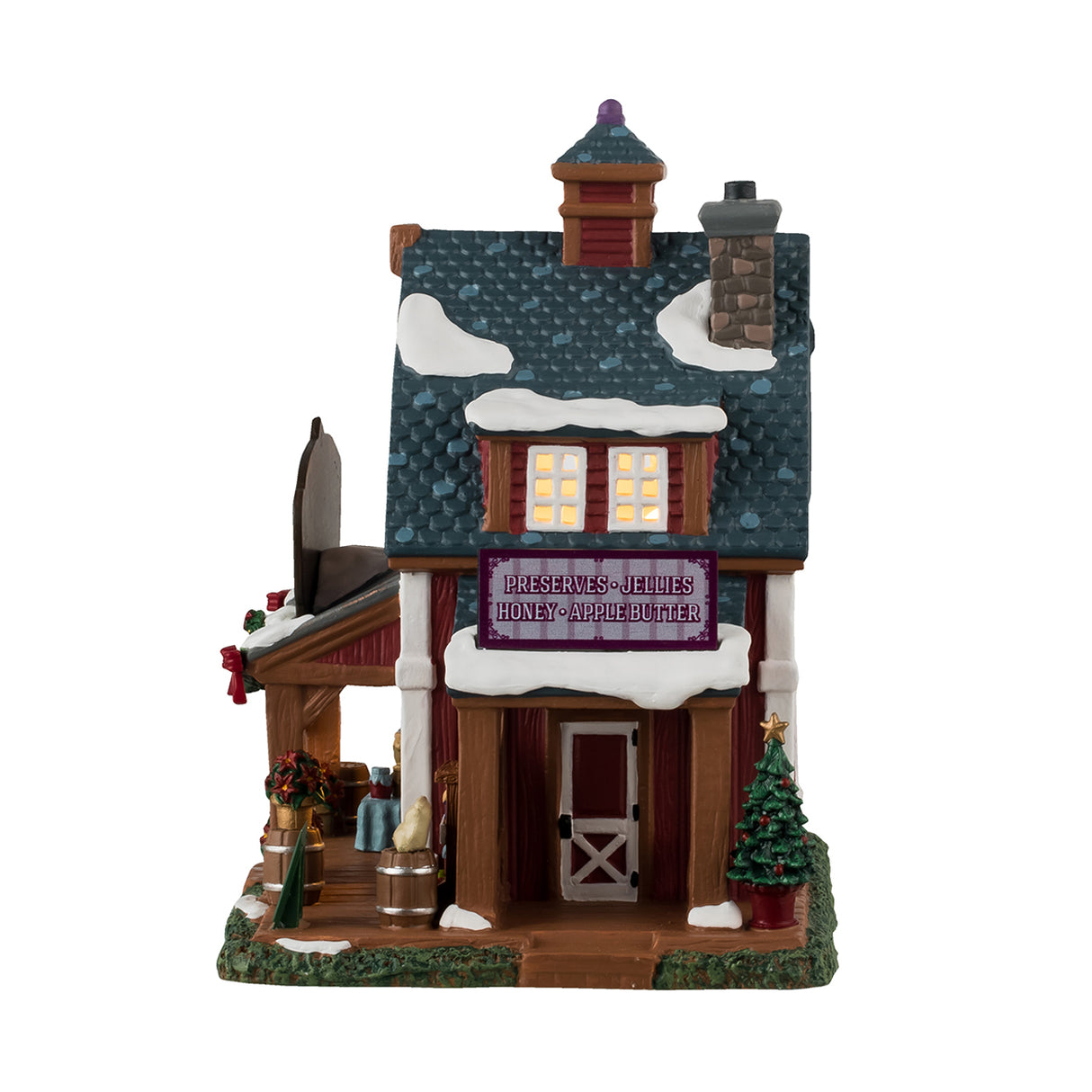 Porcelain lighted building for a Lemax display. Designed to look like a cabin with snow on the roof. There are decorated garlands and wreaths and red ribbons and poinsettias everywhere. There are signs that read: "Yes! We're open," "Christmas Sale 30% off," "Homemade honey and jelly" and "Preserves: Honey, Jellies, Apple Butter."
