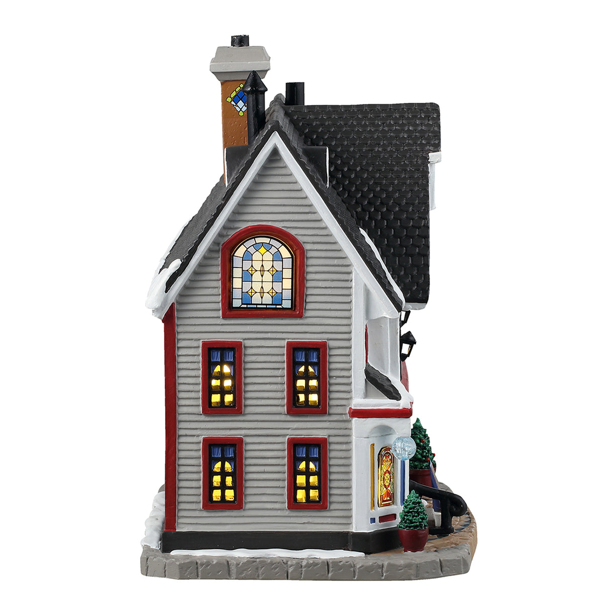 Porcelain lighted building for a Lemax display. Designed to look like a large, white house that's been turned into a shop. There's snow on the roof and most of the windows are stained glass. If you look in the window next to the door, you can see some glass vases.