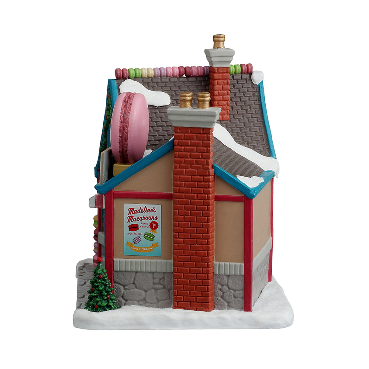 Porcelain lighted building for a Lemax display. Designed to look like a charming, little shop called Madeline's Macaroons French Pastries. Inside the window, you can see a display of macaroons. There are decorated wreaths, garland and a Christmas tree. There's snow on the ground and on the roof. There are also candy accents on the roof and macaroons on the sidewalk.