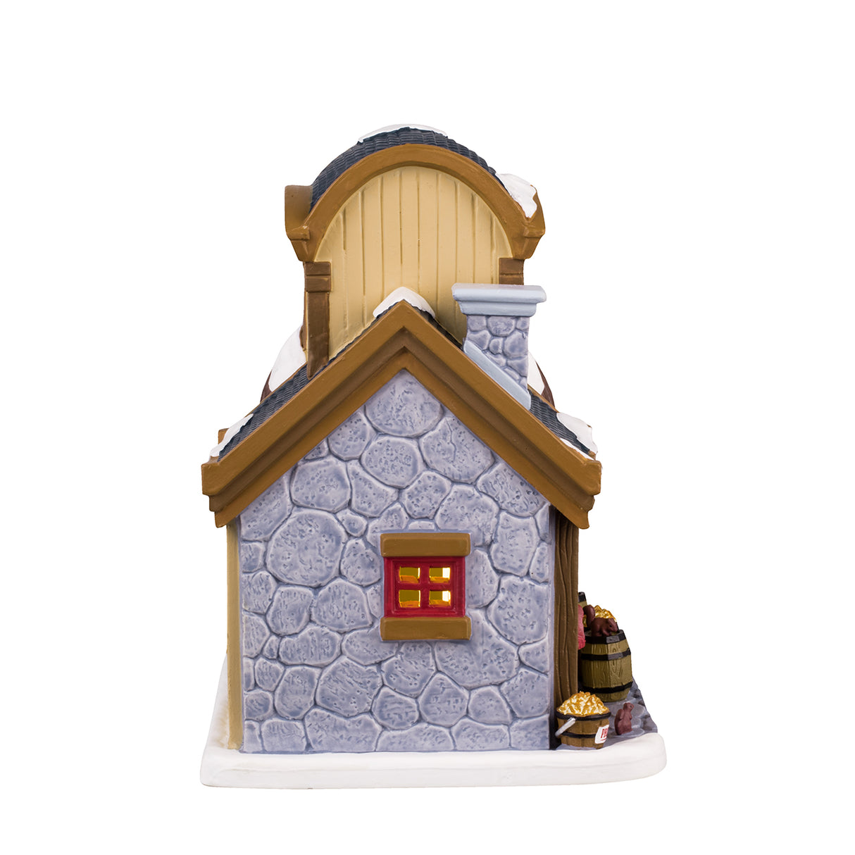 Porcelain lighted building for a Lemax Village display. Designed to look like a store booth connected to a building that is shaped like a coconut. There's snow on the roof and the sidewalk. There's a man behind the booth wearing an apron. On the upper level of the building, there's a Nut Butter Loft. There's a decorated wreath and garland near the front door. There are barrels of different nuts and a few squirrels.