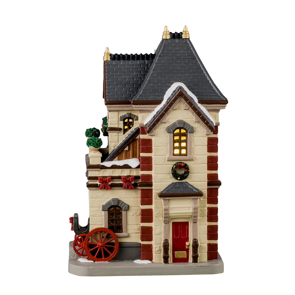 Porcelain lighted building for a Lemax display. Designed to look like a tall building with snow on the roof and the sidewalk. There's decorated garlands and wreaths and potted plants. There are red bow accents. There's a carriage peaking out from a garage.