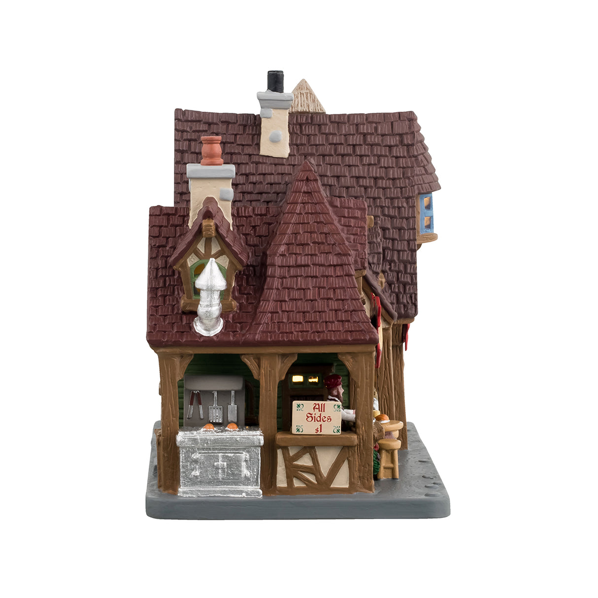 Porcelain lighted building for a Lemax display. Designed to look like a renaissance cottage with different shops. Get a turkey leg at Tom's. Buy a helmet that's on sale at the armory. Get hand-crafted jewelry and wooden swords. Tom's Turkey Legs is a light green color. The other shops are a light blue color.