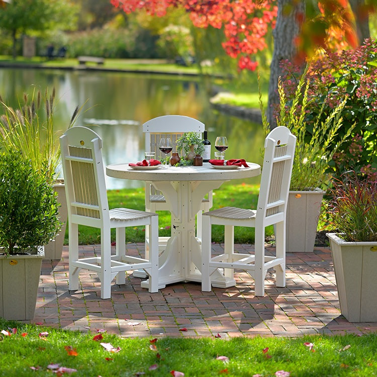 This is a lifestyle image showing the Birch and White table surrounded by matching chairs.