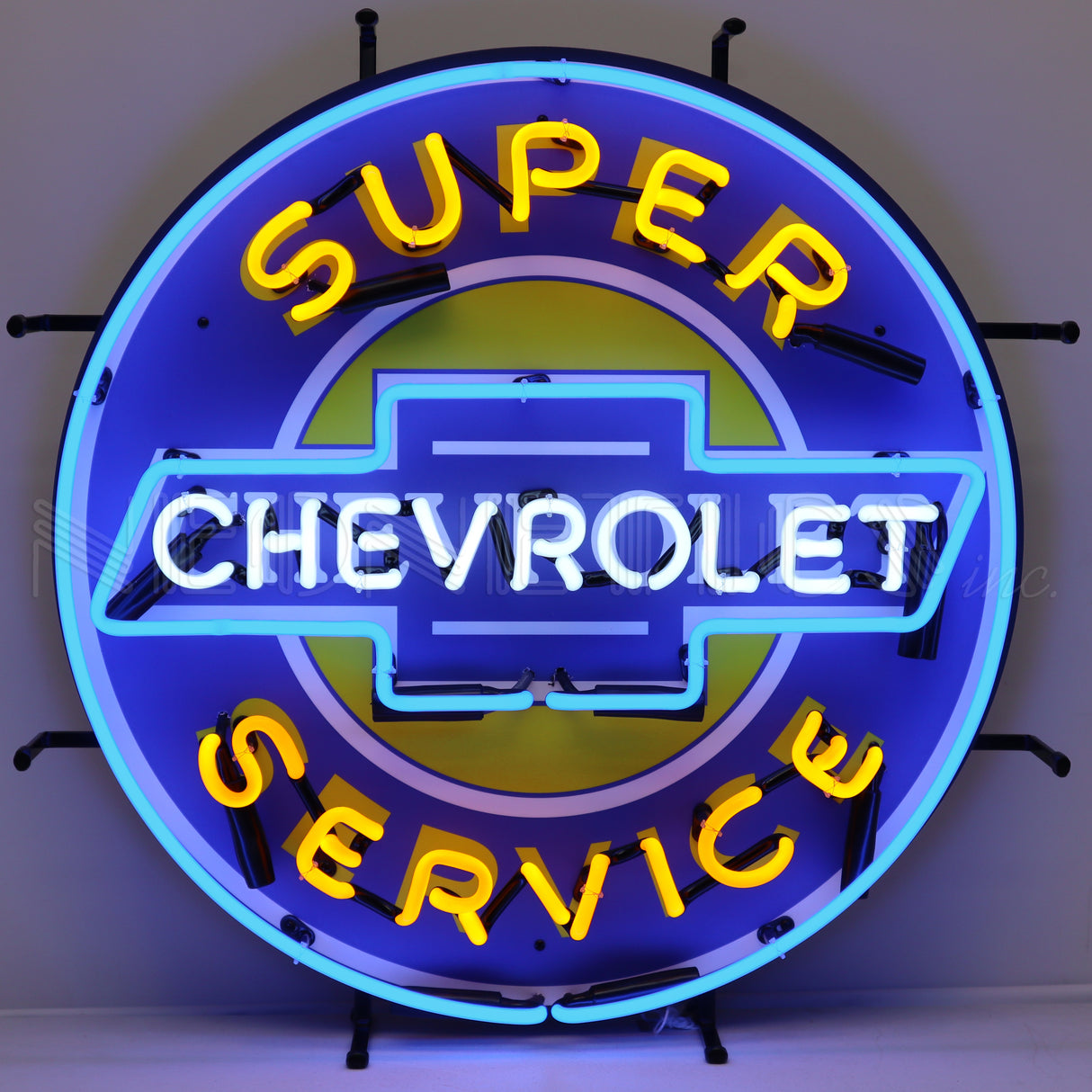This particular image shows the neon sign with the lights on. Circular neon sign that reads "Super Chevrolet Service." "Super" and "Service" are yellow. "Chevrolet" is in white. The border of the neon sign is light blue and inside the sign is a yellow circle with a white border.