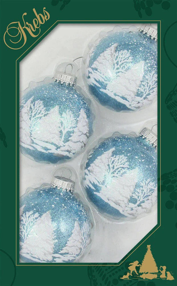 Set of ornaments decorated with light blue and white glitter. The ornaments have woodland scenes involving trees and a deer.