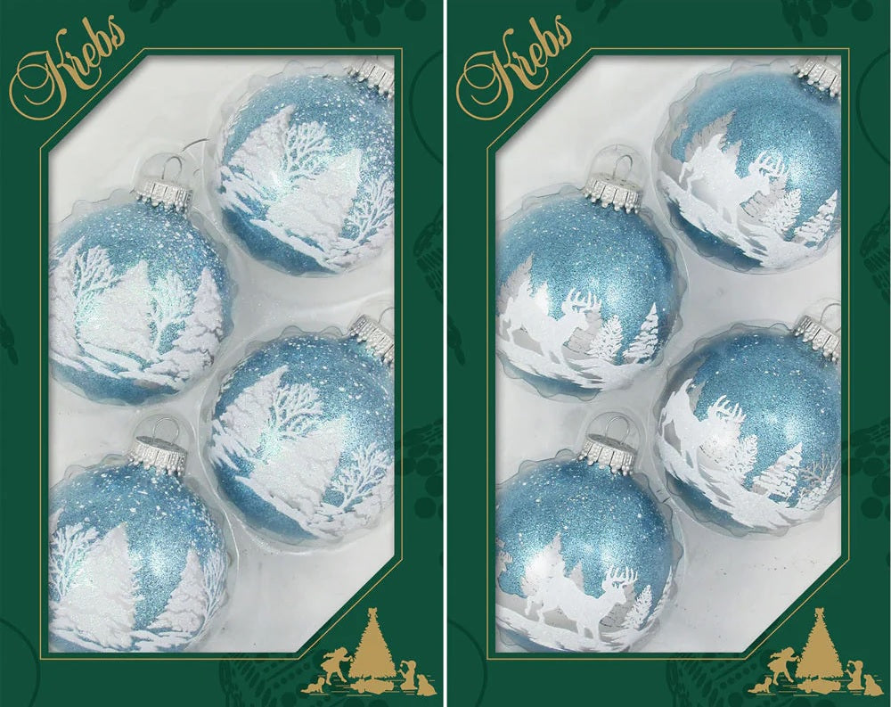 Set of ornaments decorated with light blue and white glitter. The ornaments have woodland scenes involving trees and a deer.