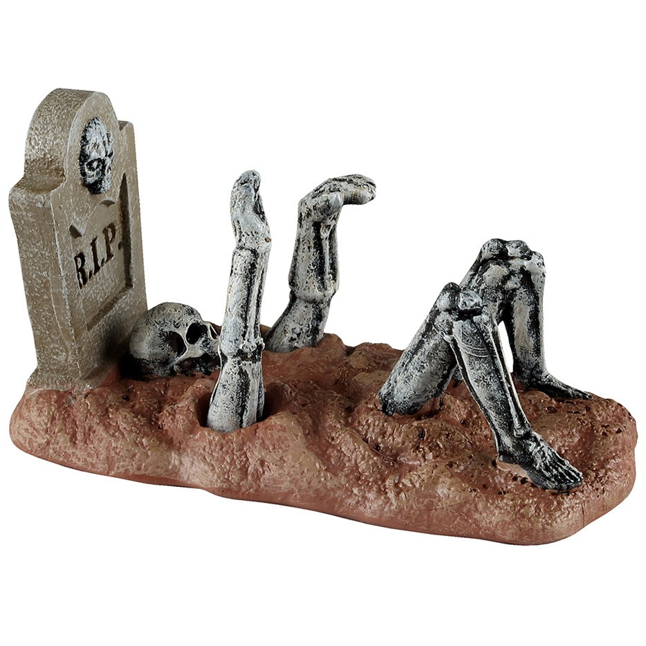 This image shows what this Lemax Spooky Town figurine looks like on a white background. It was designed to look like a skeleton clawing it's way out of the ground in front of a tombstone that reads "RIP."