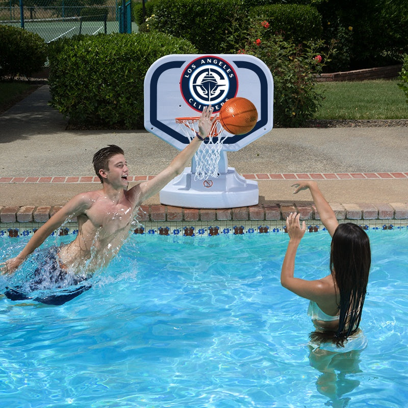This is a lifestyle image showing two people playing basketball in the pool, aiming the ball for the Los Angeles Clippers themed basketball hoop.