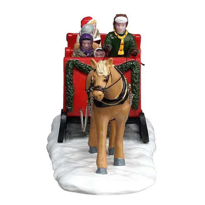 This image shows what the table piece looks like from head-on. The front of the sleigh is decorated with garland.