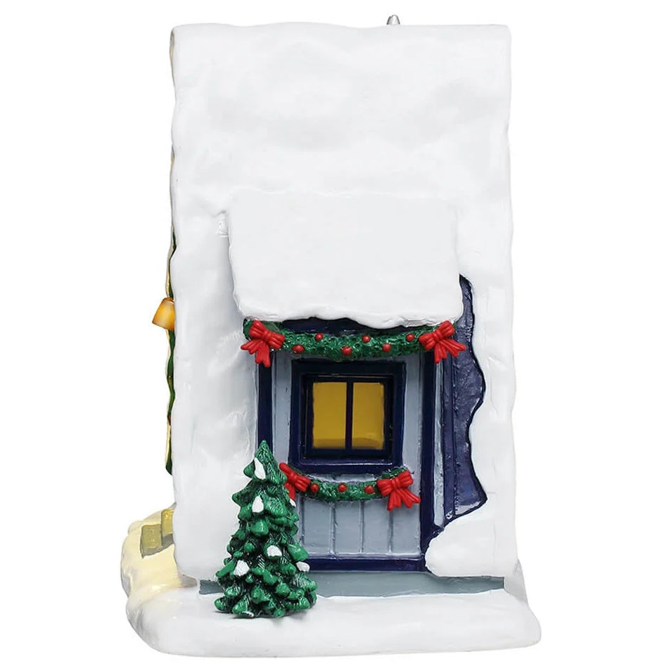 This image shows what the side of the table accent looks like. There's a window decorated with garland and red bows.