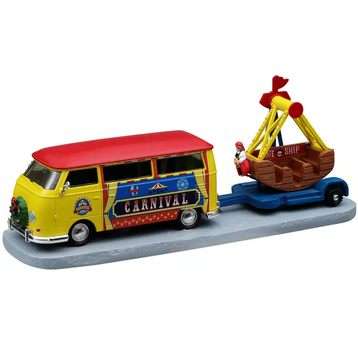 This image shows what this Lemax Carnival item looks like on a white background. It was designed to look like a vintage van pulling a carnival ride. The ride reads "Pirate Ship" and looks like a boat. There's a fake pirate at the front of it.