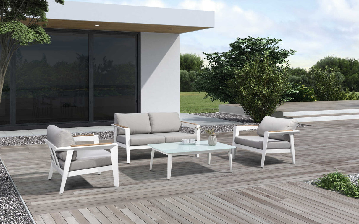 This is a lifestyle image showing the patio furniture set on a wooden deck on the side of a house.