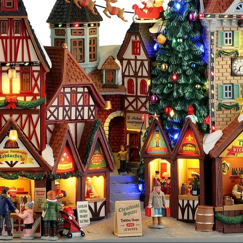 This is an up close view of this building facade. There are people shopping on the sidewalk and people standing in the shop stalls, waiting for more shoppers.