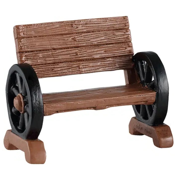 This image shows one of the wooden benches with the wheel armrests.