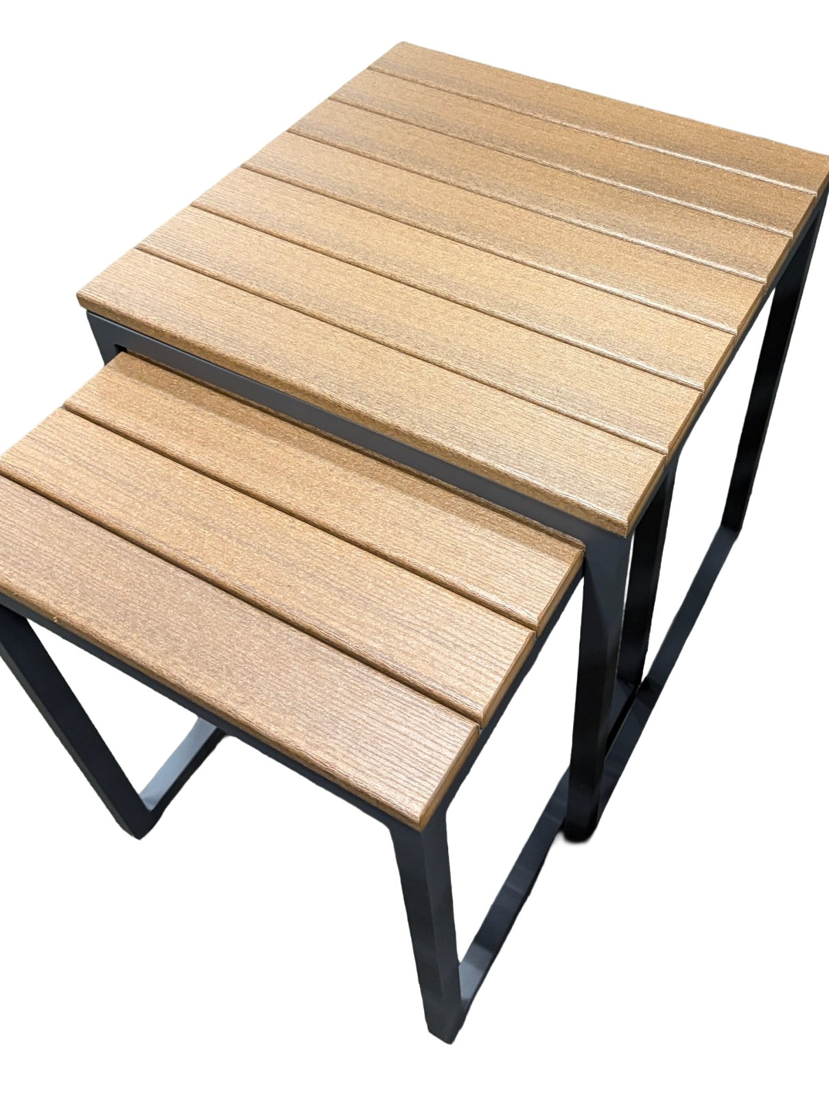 This image shows these nesting tables on a white background. The frames are a dark gray color and the tabletop is antique mahogany.
