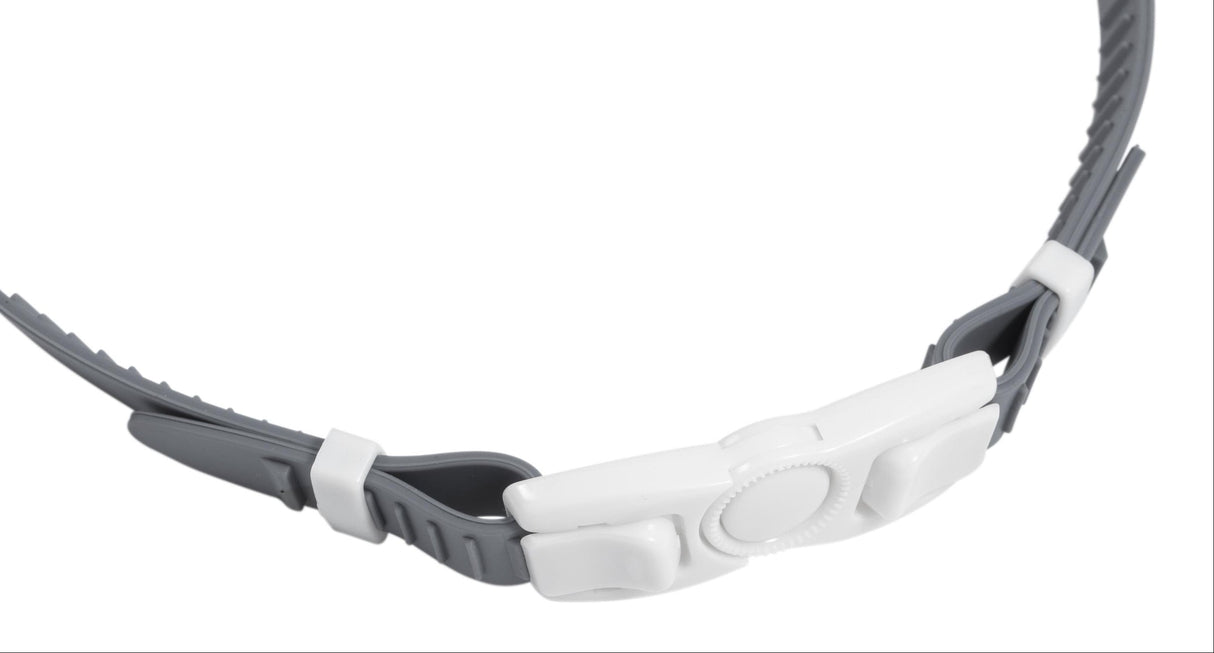 This image is an up close view of the unique clasp on this swim mask. The clasp is white and the head strap is gray.