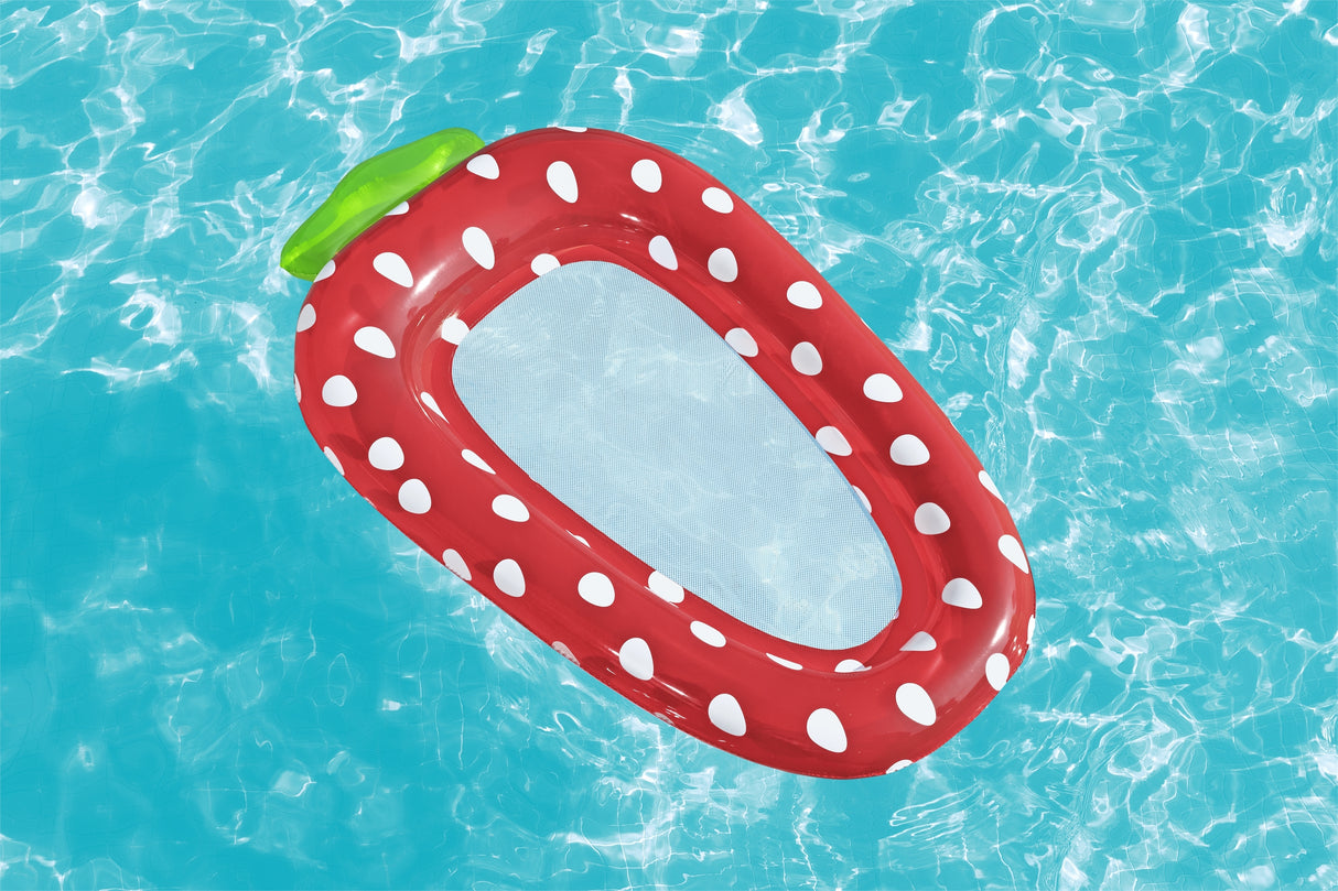 This is a lifestyle image showing the strawberry pool lounge floating atop the pool water.