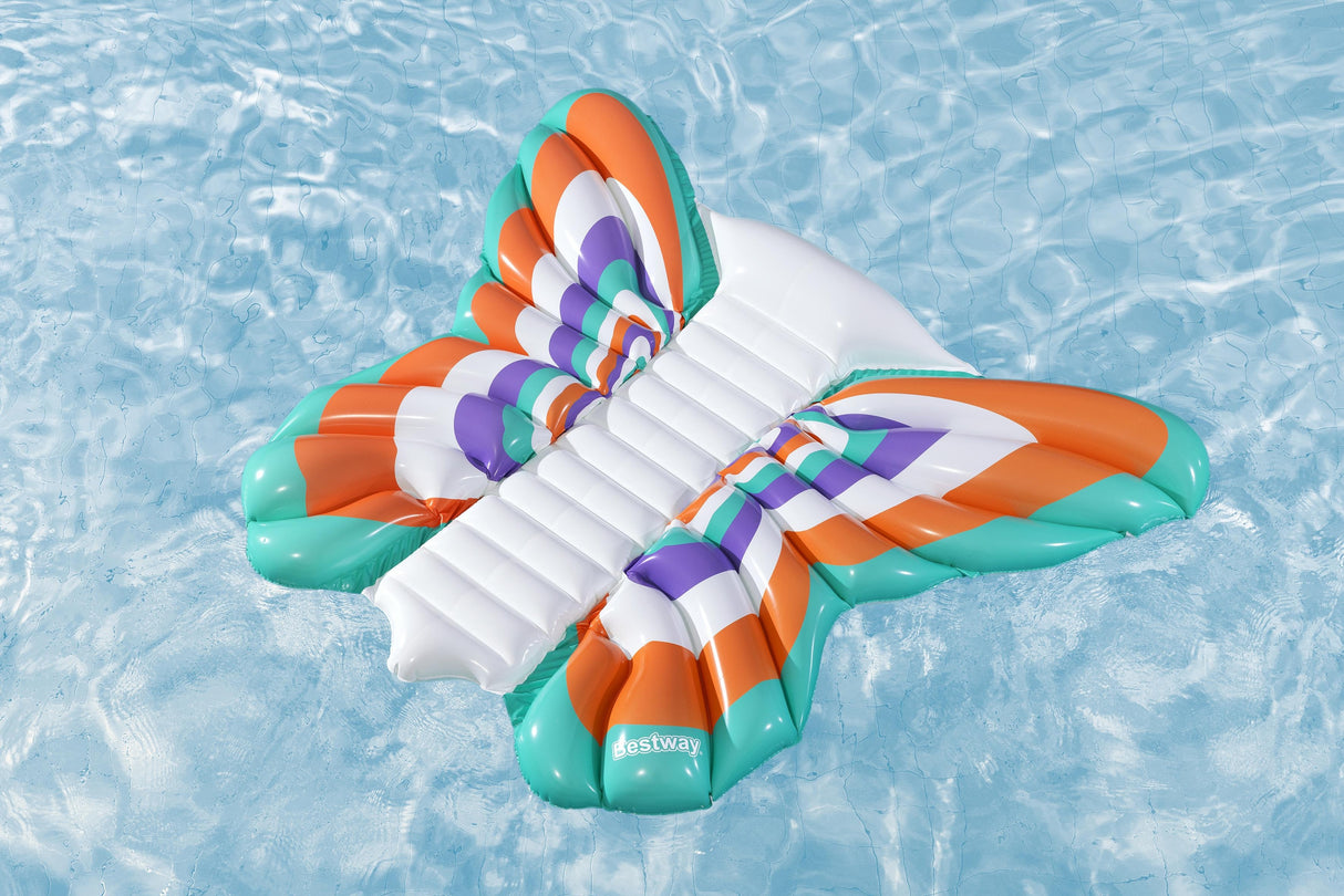 This image shows the pool lounge shaped like a butterfly floating on top of the water.