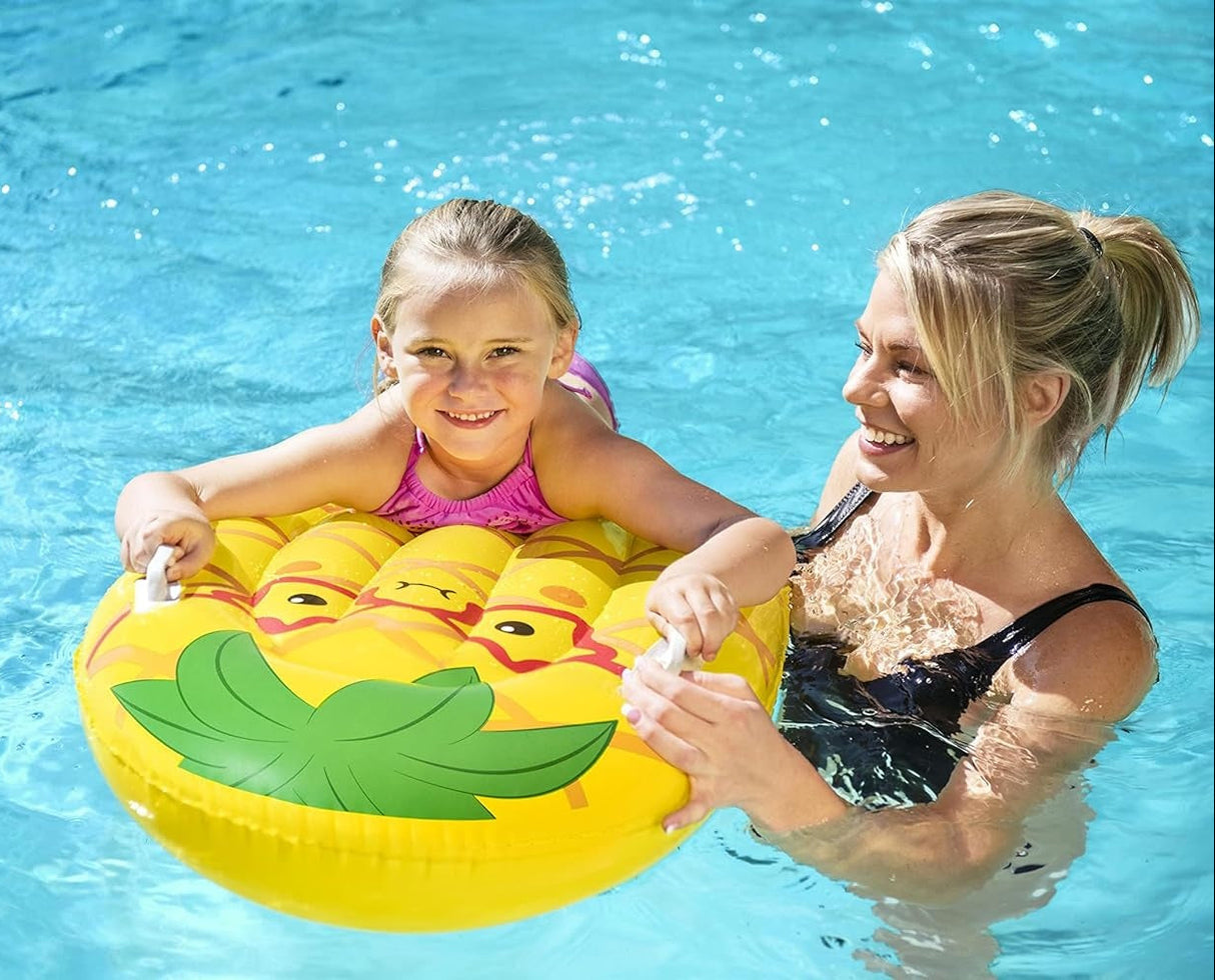 This is a lifestyle image showing a little girl holding onto the handles of this pool inflatable while her mom leads her through the water.