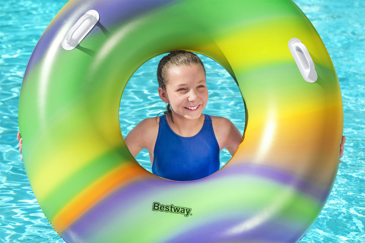 This is a lifestyle image showing a young girl holding the inner tube so it frames her face.