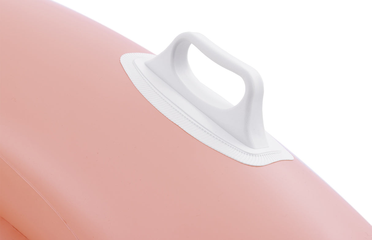 This is an up close view of the pink pool chair's white handle.