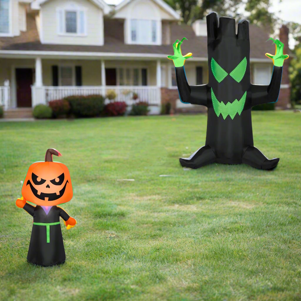 This image shows the two inflatables that come in this combo pack. They're standing on a grassy hill with a house in the background.