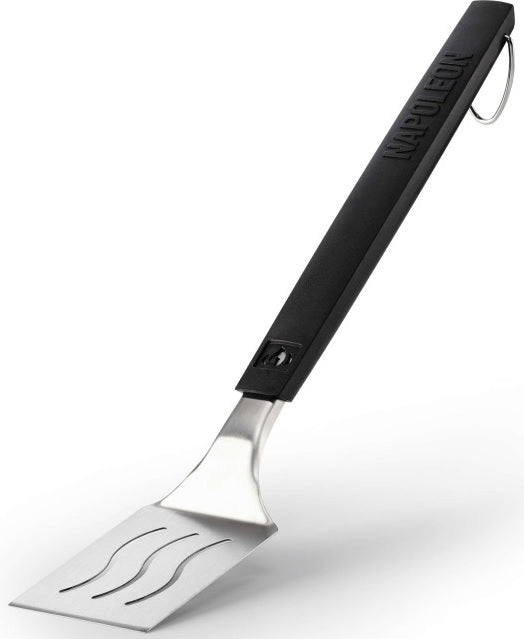 An up close view of this Napoleon spatula. The handle is black and at the top, features the Napoleon "fire" logo and at the bottom, it reads "NAPOLEON." The head of the spatula is stainless steel silver with three slightly wavy cut out lines. There's also a stainless steel hook at the end of the handle. This image has a shadow underneath the spatula head.