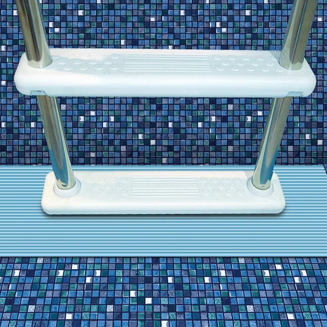 This is a lifestyle image showing a light blue pool mat underneath a pool ladder.
