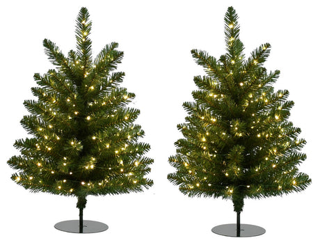 This image shows the two small pre-lit trees on a white background. They both have black stands.