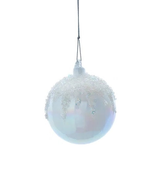This image shows the round, glass white ornament with clear glitter up on the top.